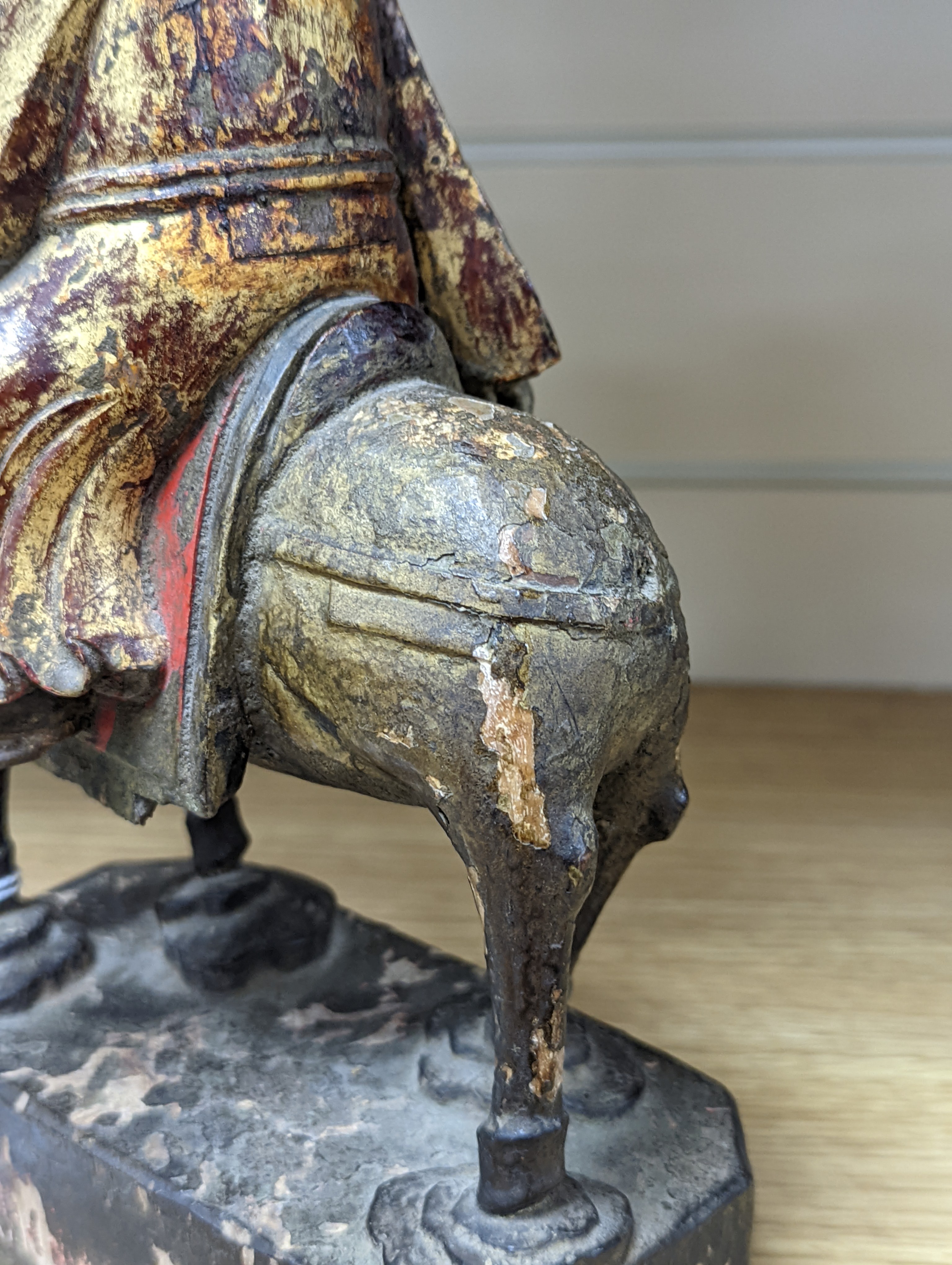 An 18th/19th century Chinese lacquered wood group of an official riding a horse, 30cm